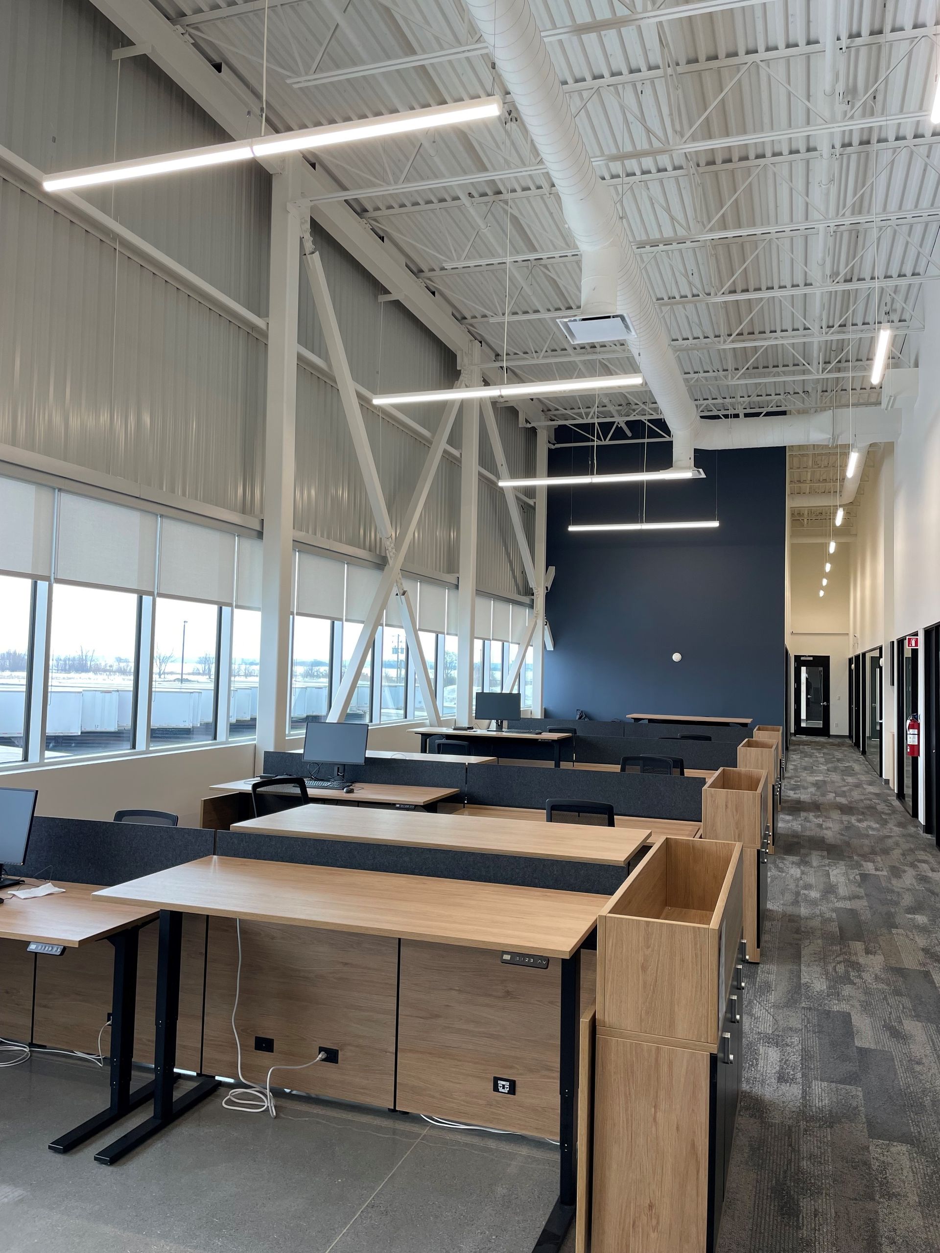 A large office with lots of desks and chairs