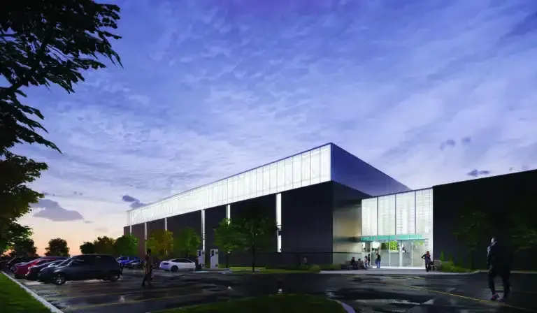 An artist 's impression of a large building with a parking lot in front of it.