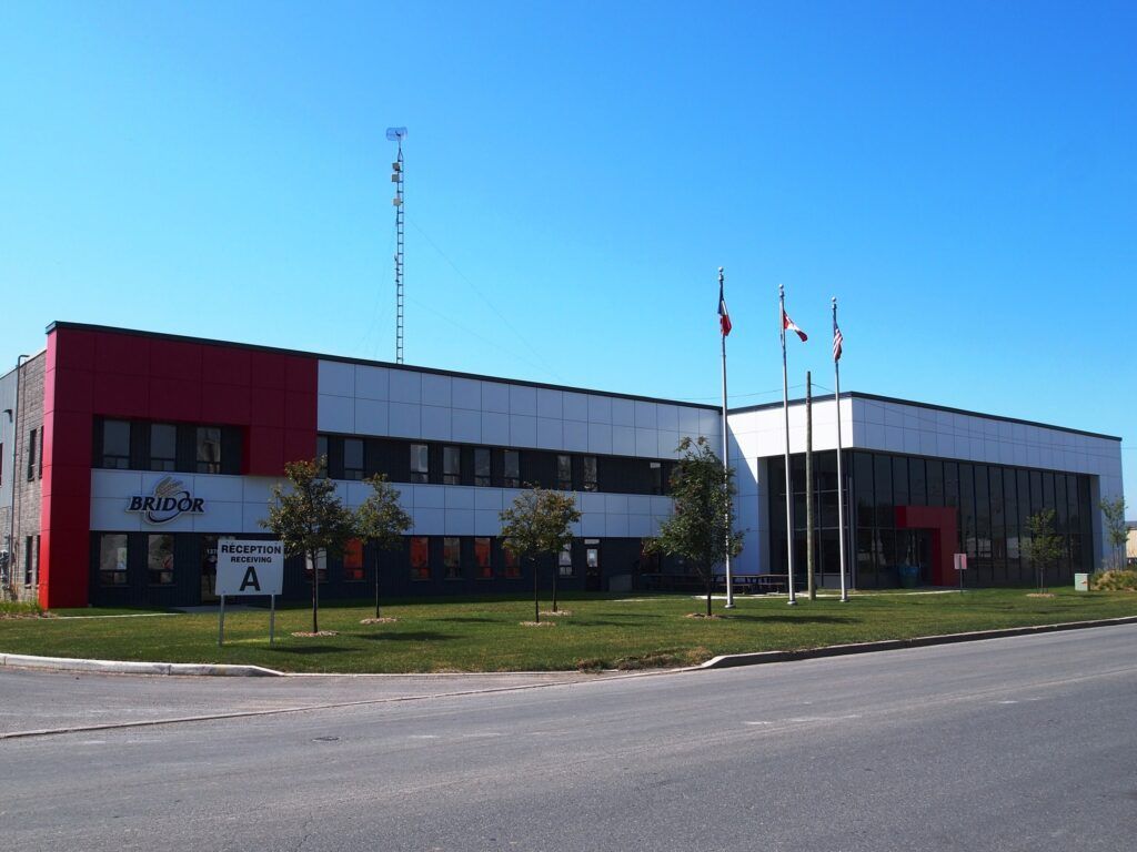 A large red and white building with the letter a on it