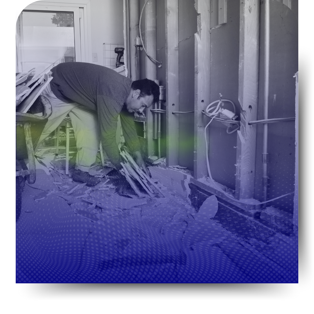 A man cleaning construction garbage