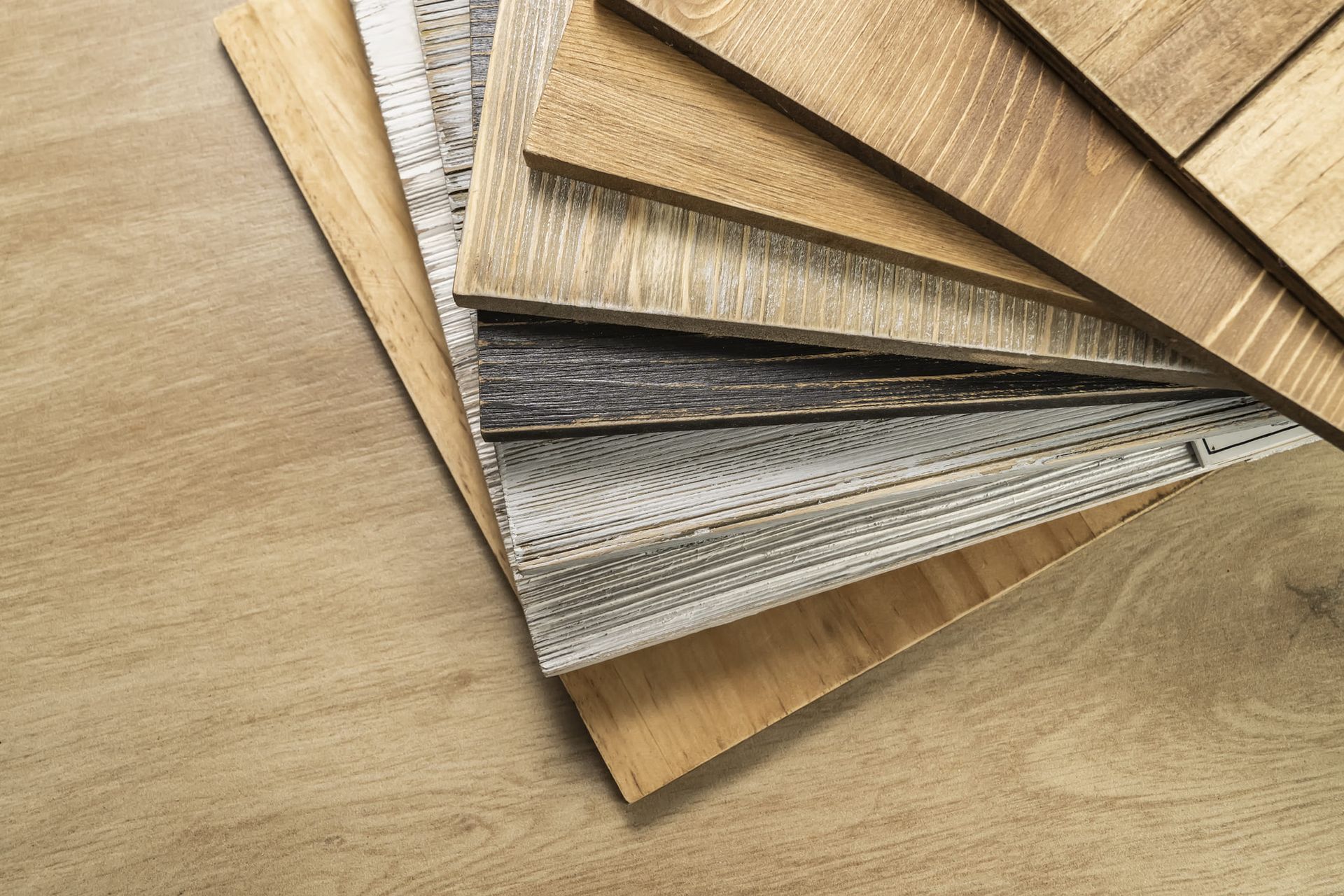 A stack of wooden samples on a wooden table.
