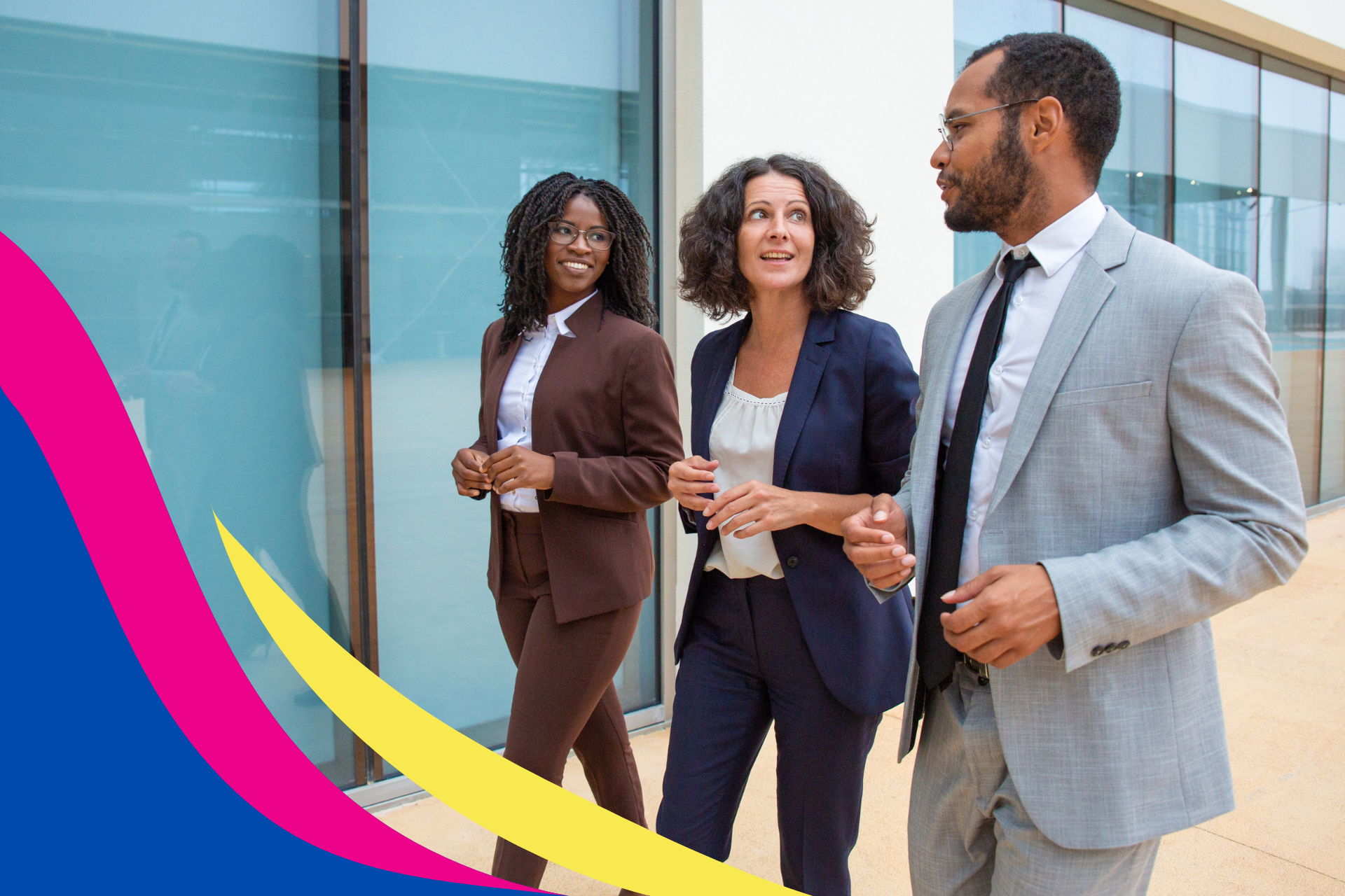 A group of business people are walking in front of a building.