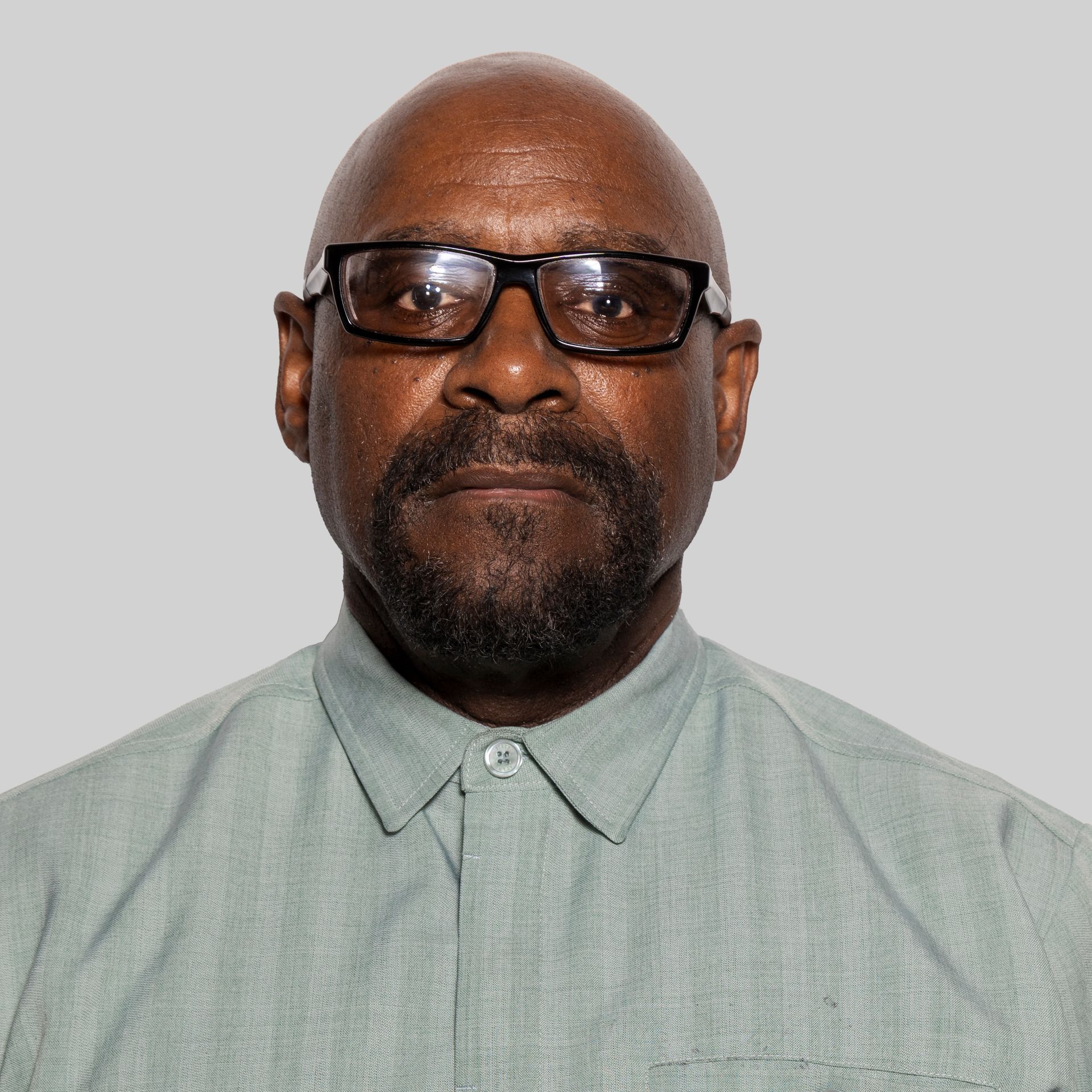 A man with a beard wearing a baseball cap