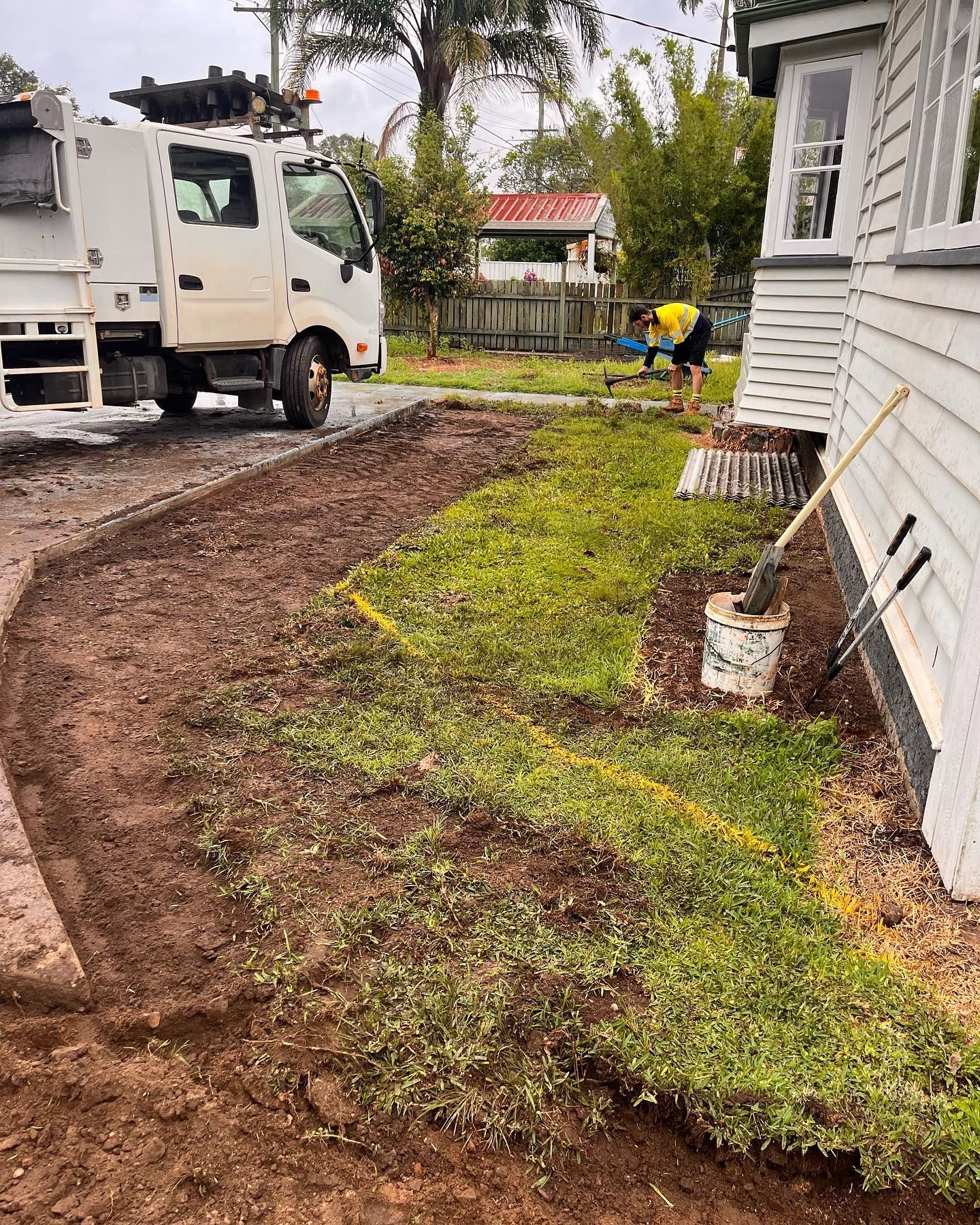 Truck, Worker, Preparing Lawn Next to a House, Dirt Path, Green Grass — All Access Mini Earthworks in Innes Park, QLD