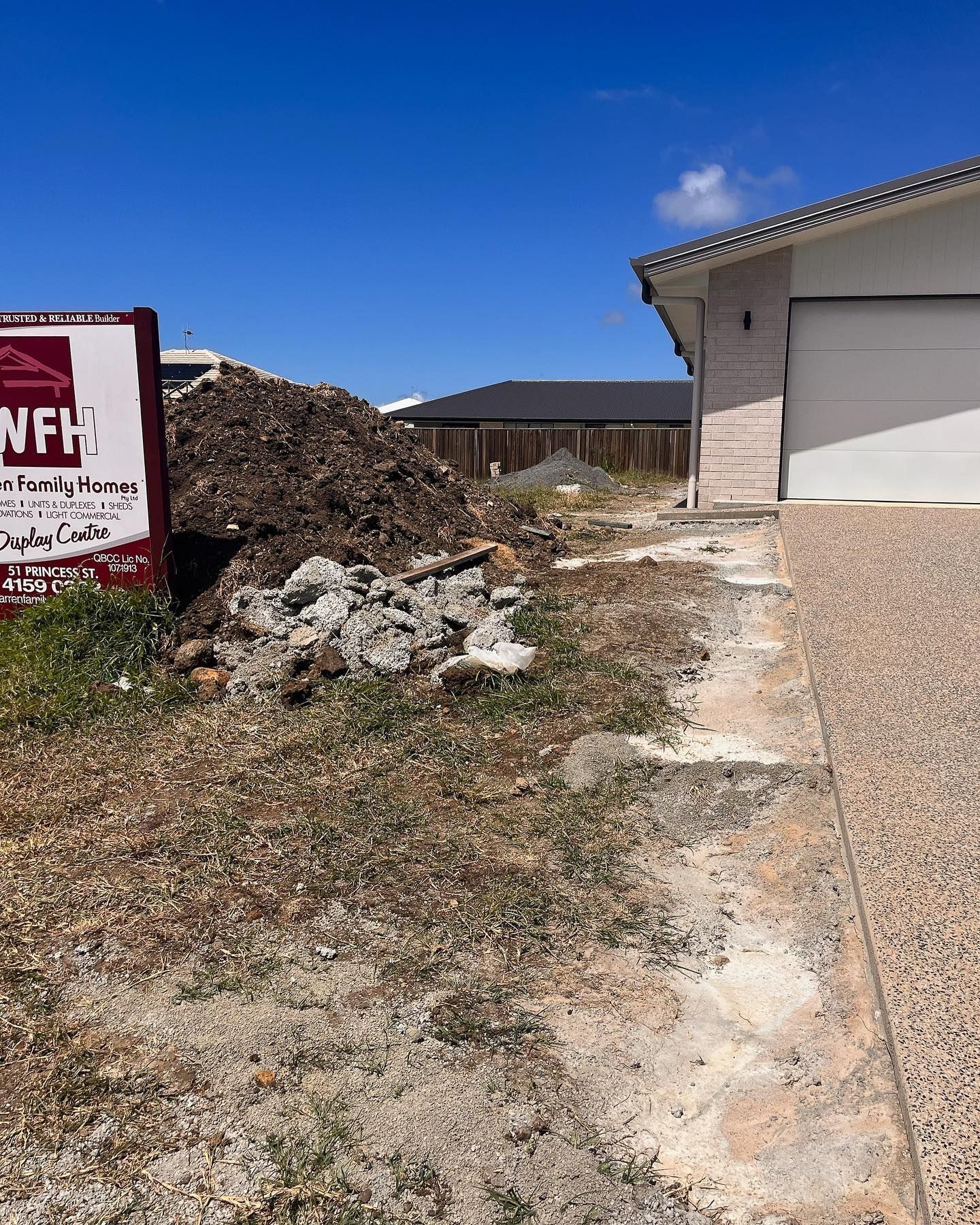 Construction Site With a Pile of Dirt and a Partially Built House — All Access Mini Earthworks in Gin Gin, QLD