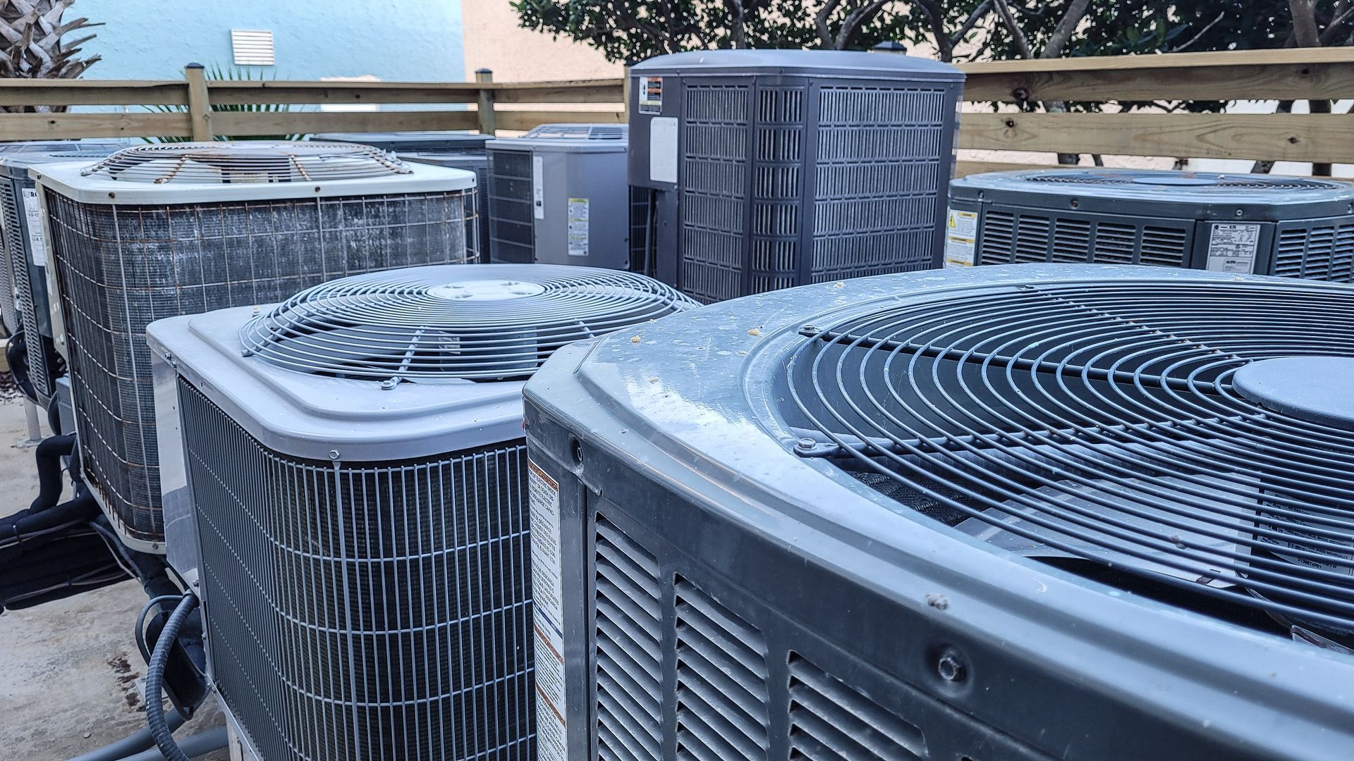 Icy rooftop HVAC units with frost covering the grilles on a cold morning