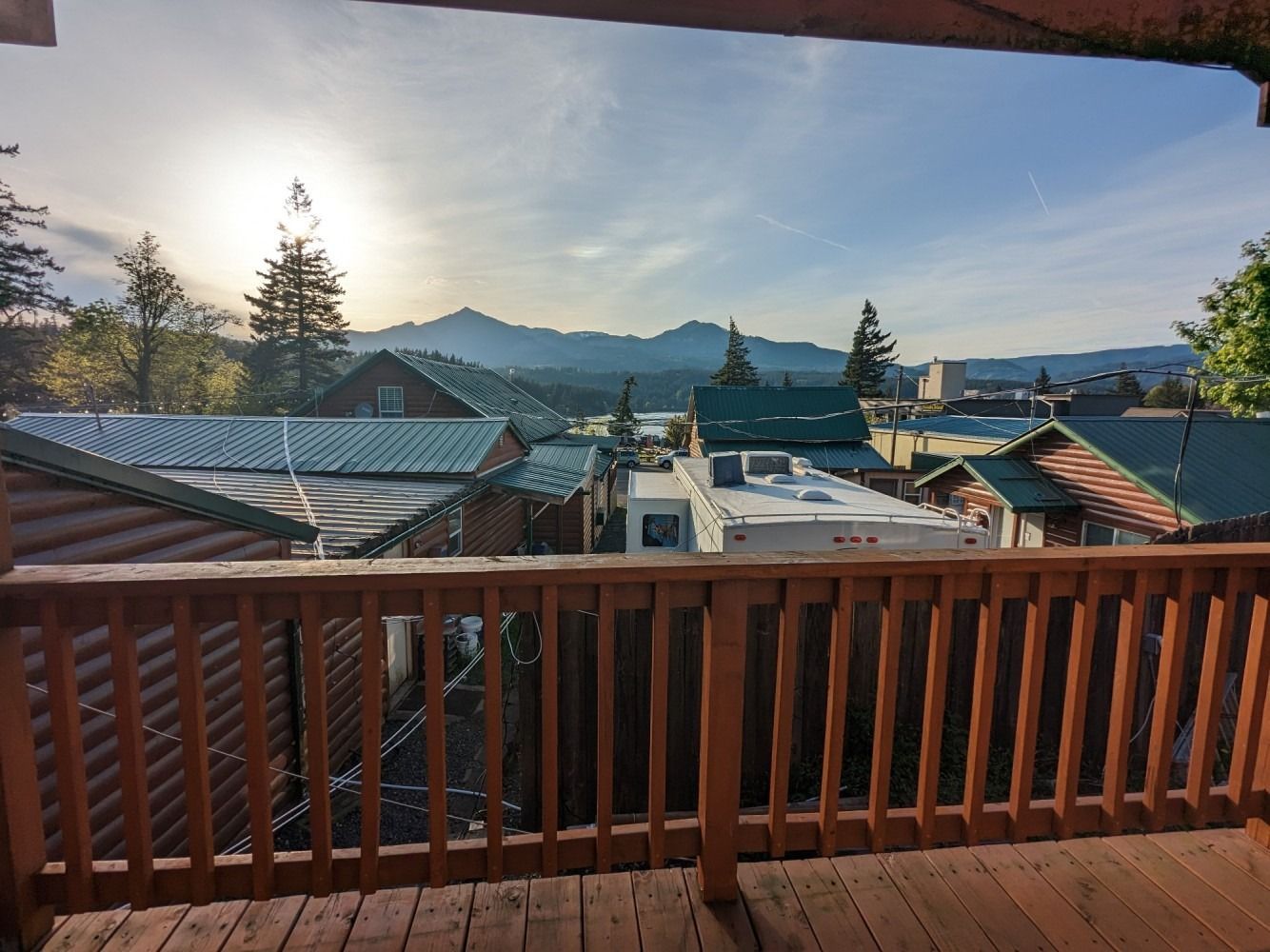A view of a small town from a wooden deck