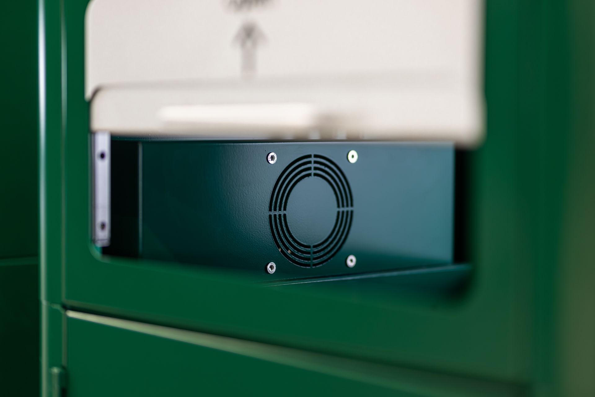 Green guardian BIO bin panel with a circular ventilation and vent grille and visible 
