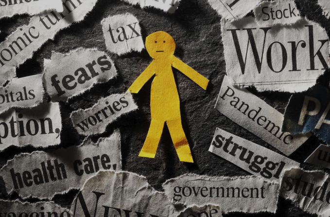 A yellow stick figure is surrounded by newspaper headlines including worries and work