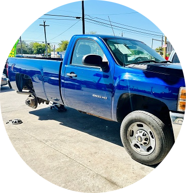 A blue truck is parked on the side of the road | Cordova Auto Center #4