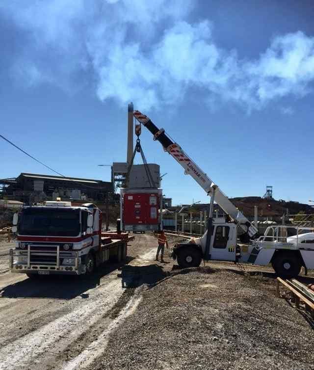 A Truck With a Crane on the Back — Reliable Machinery Transport in Mareeba, QLD