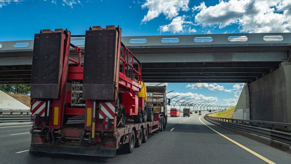 Fixed Low Loader Trawl Truck Carries Special Equipment — Container, Machinery & General Freight Transport in Mackay, QLD