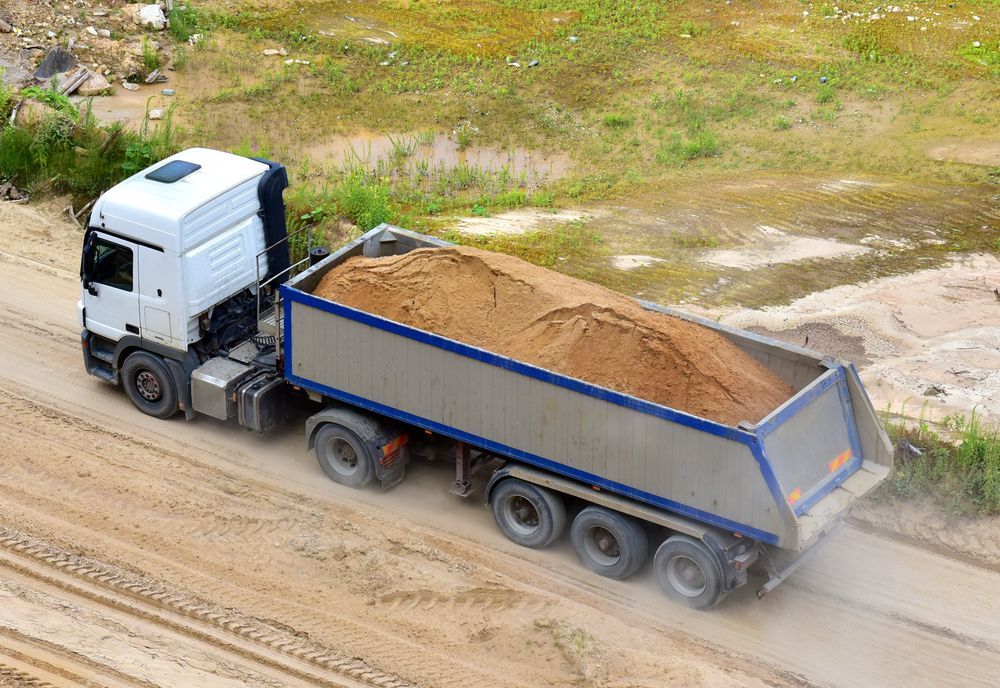 Truck With Tipper Semi Trailer Transported Sand From the Quarry — Container, Machinery & General Freight Transport in Atherton, QLD