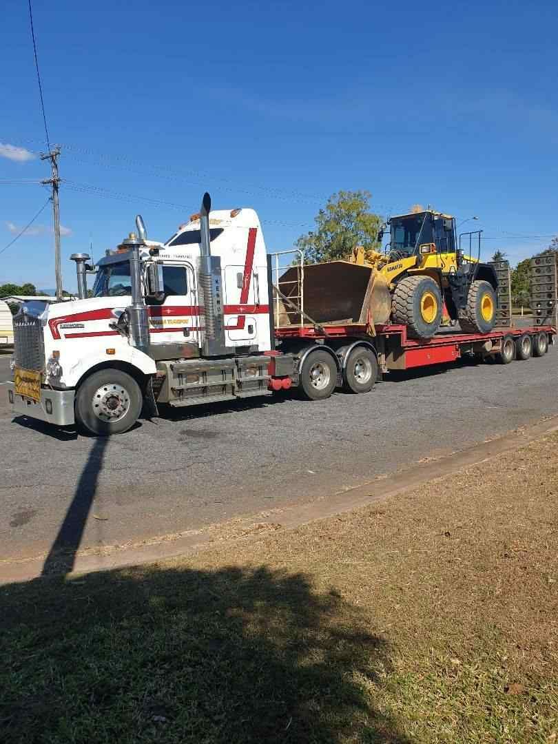 A Trailer Loaded a Tractor — Reliable Machinery Transport in Mareeba, QLD
