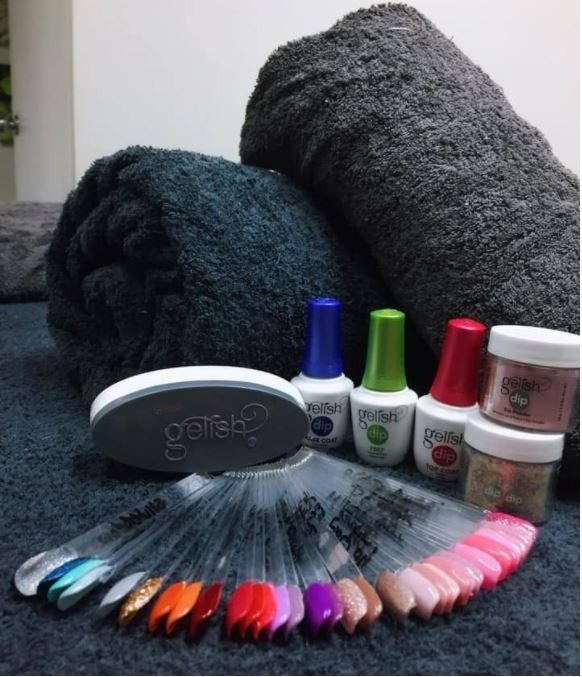 A Bunch of Nail Polish Bottles Are on a Table — Nailz By Dezign In Airlie Beach, QLD