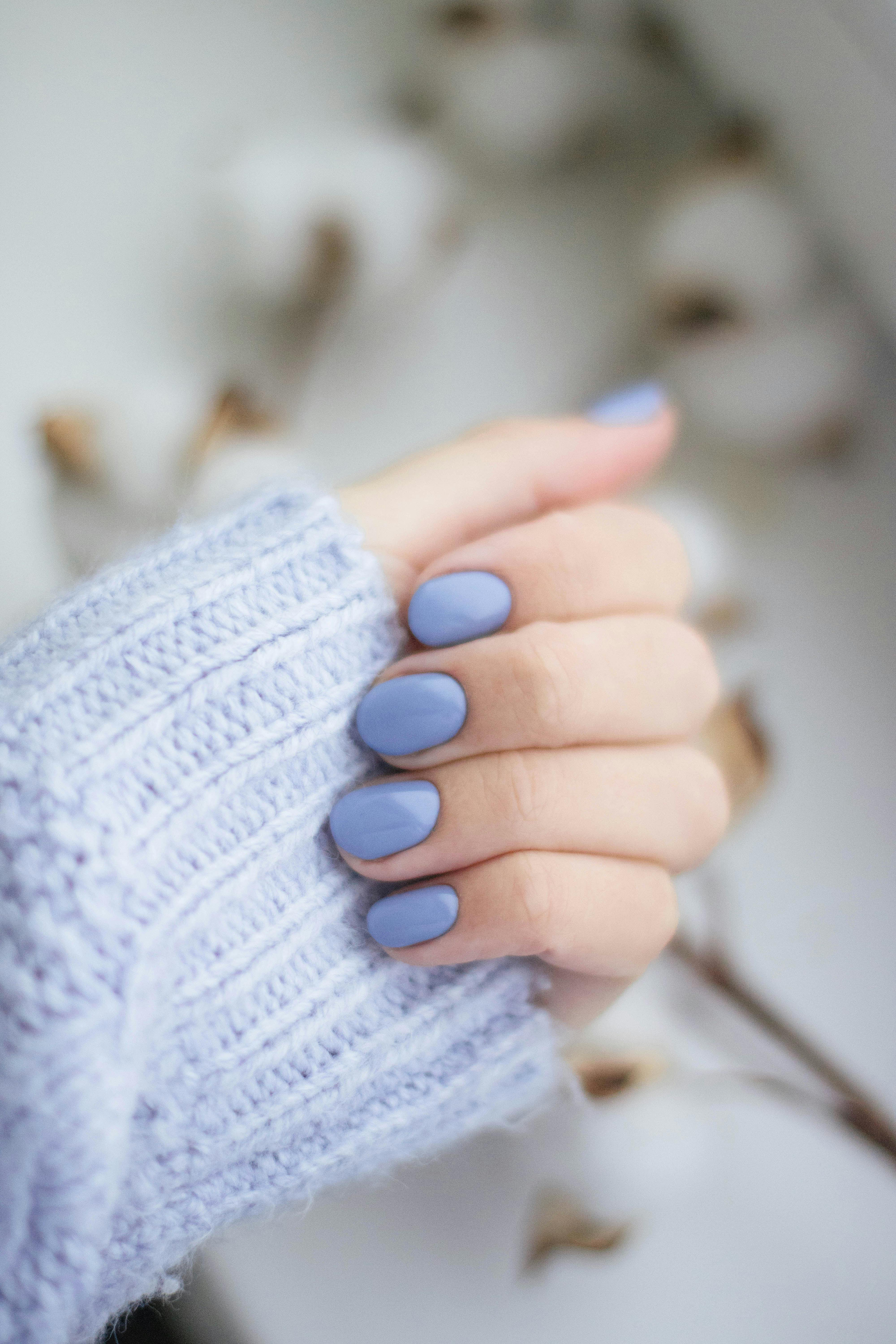 A Person is Holding a Bottle of Liquid Sand Nail Polish — Nailz By Dezign In Airlie Beach, QLD