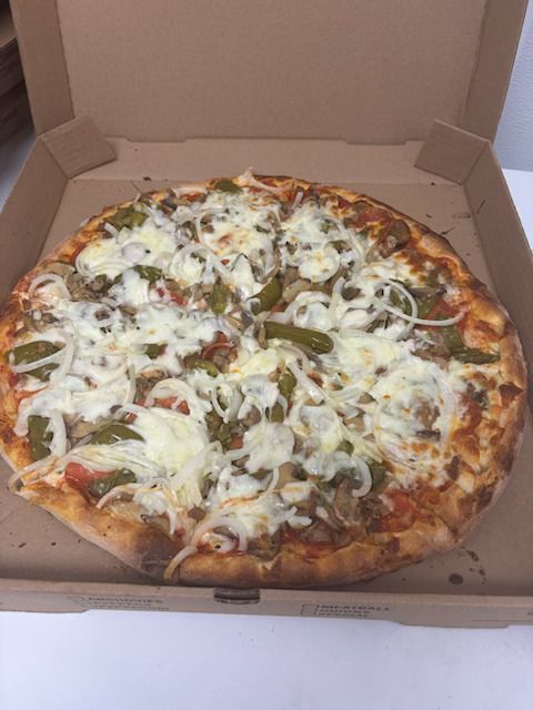 A pizza with a lot of cheese and sauce on it A pizza with a lot of cheese and sauce on it