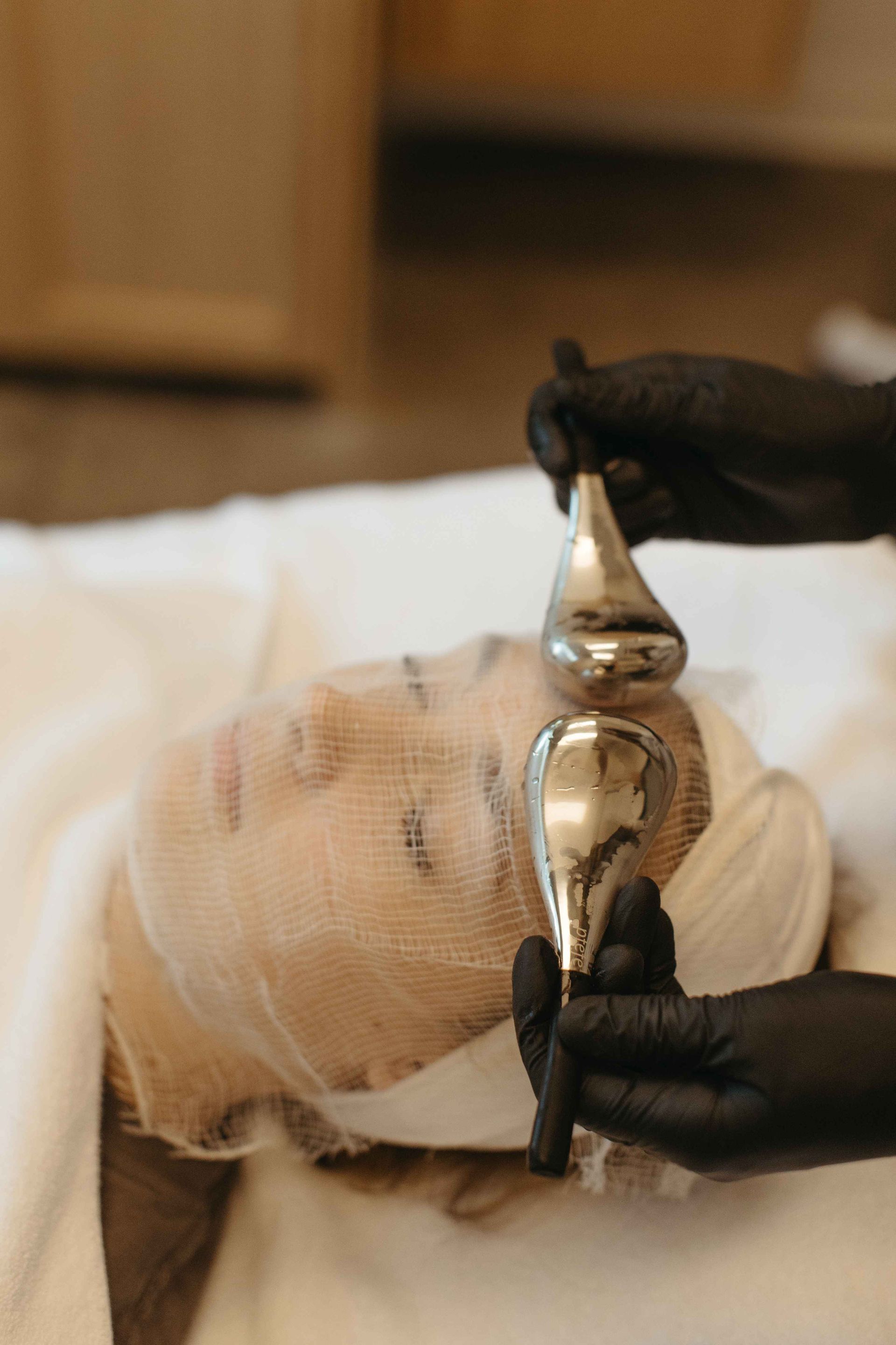 A woman is getting a facial treatment at a spa