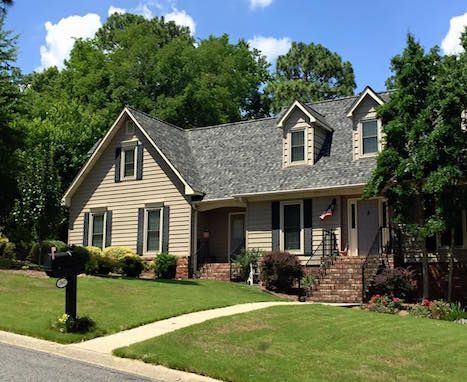 A house with a mailbox in front of it