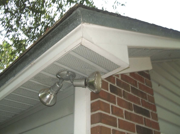 A light on the side of a brick house