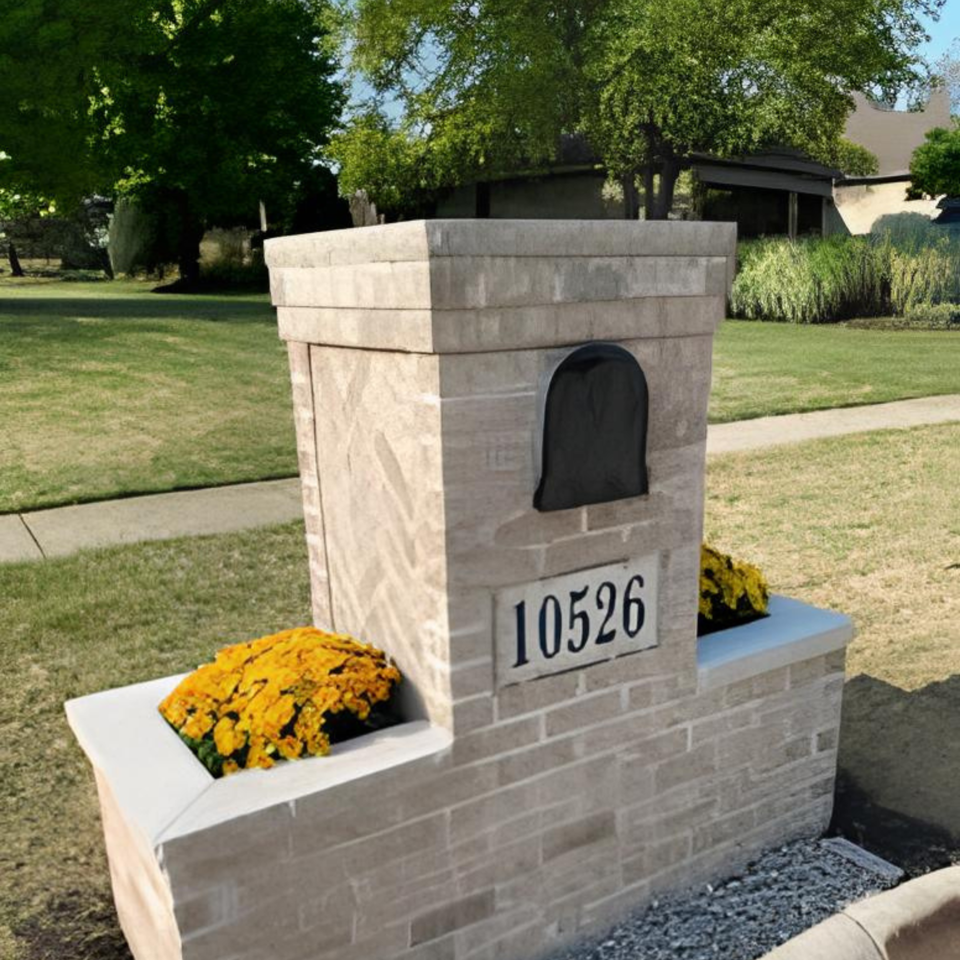 A brick mailbox with the address 10526 on it
