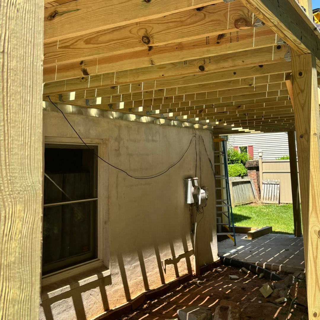 A close up of a wooden deck with a lot of boards.