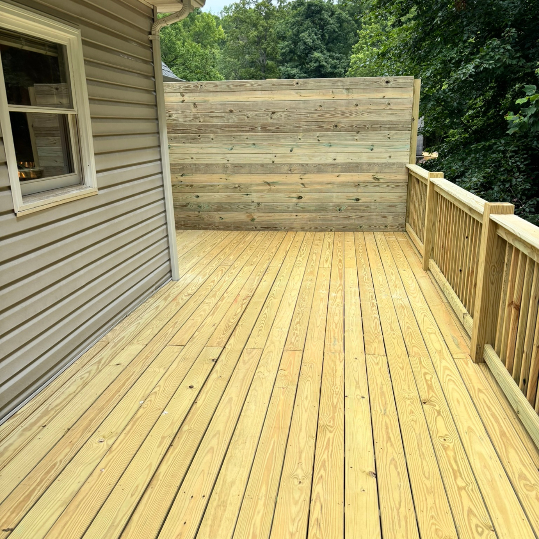 A close up of a wooden deck with a lot of boards.