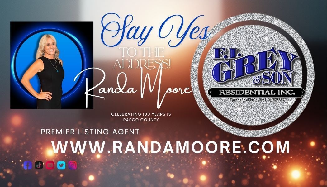 Real estate agent Randa Moore's business card. Blonde woman in black dress, name, website, company logo, and tagline.