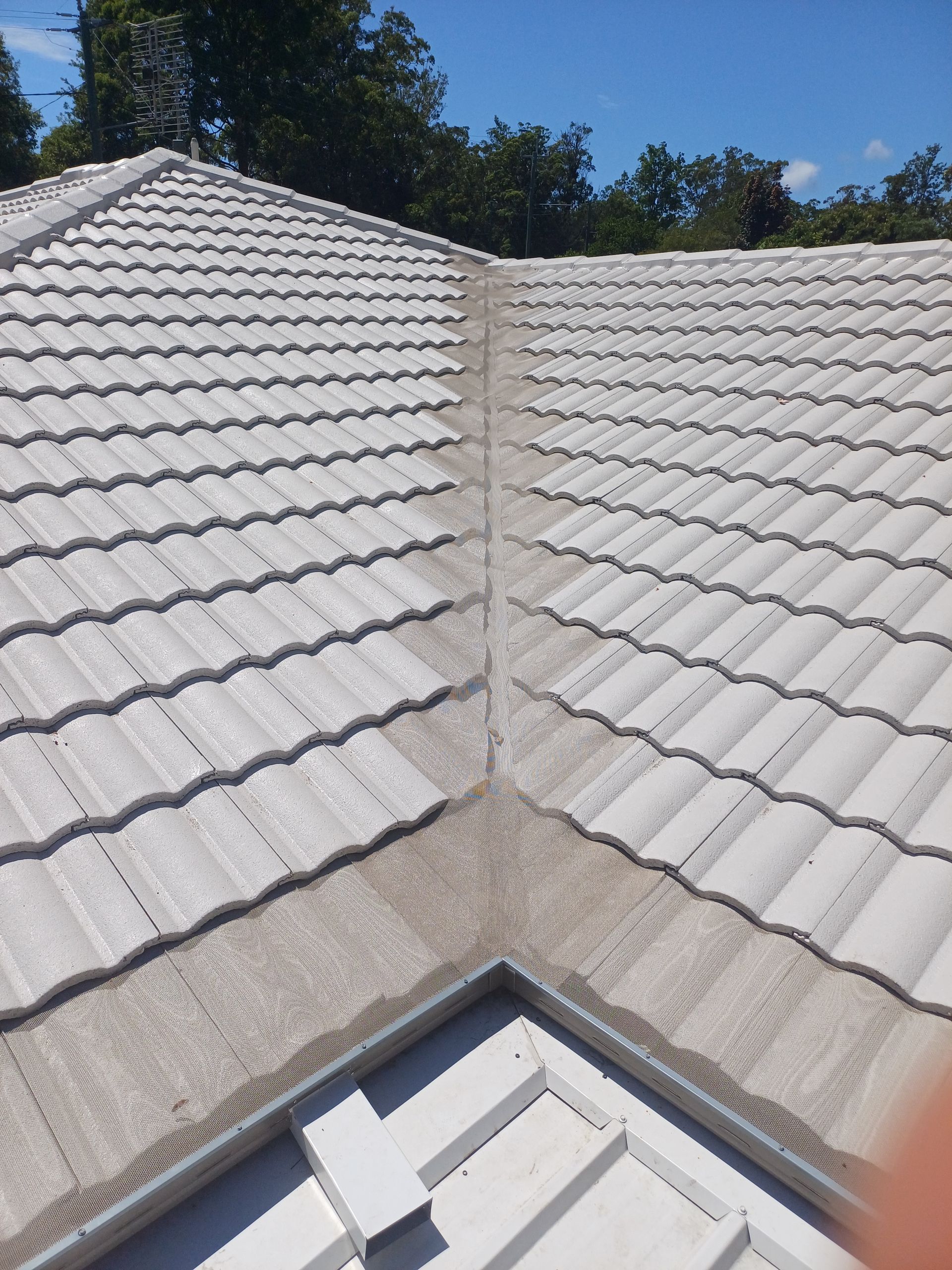 A Roof With Cream Tiles — Rooftech Roofing Services in Northern Rivers, NSW