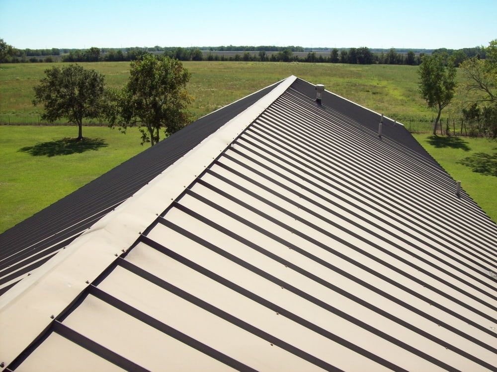 An Aerial View of A Roof with Trees in The Background — Rooftech Roofing Services in Casino, NSW
