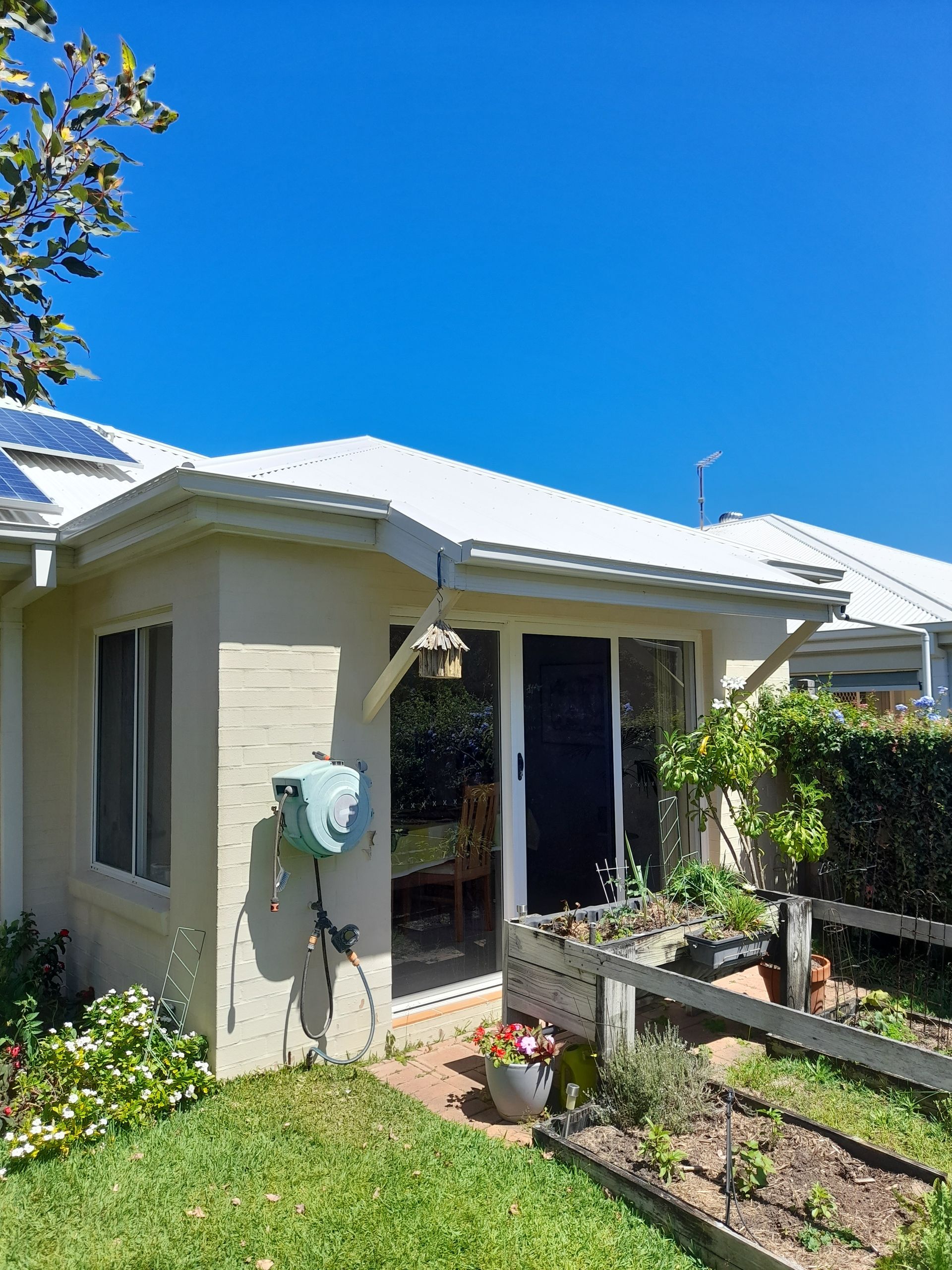 A White House With A White Roof — Rooftech Roofing Services in Ballina, NSW