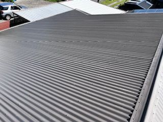 A close up of a roof with a car parked in the background — Rooftech Roofing Services in Northern Rivers, NSW