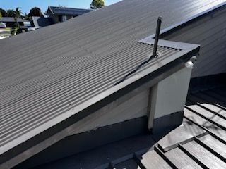 A Close Up Of A Roof With A Antenna On Top Of It — Rooftech Roofing Services in Casino, NSW