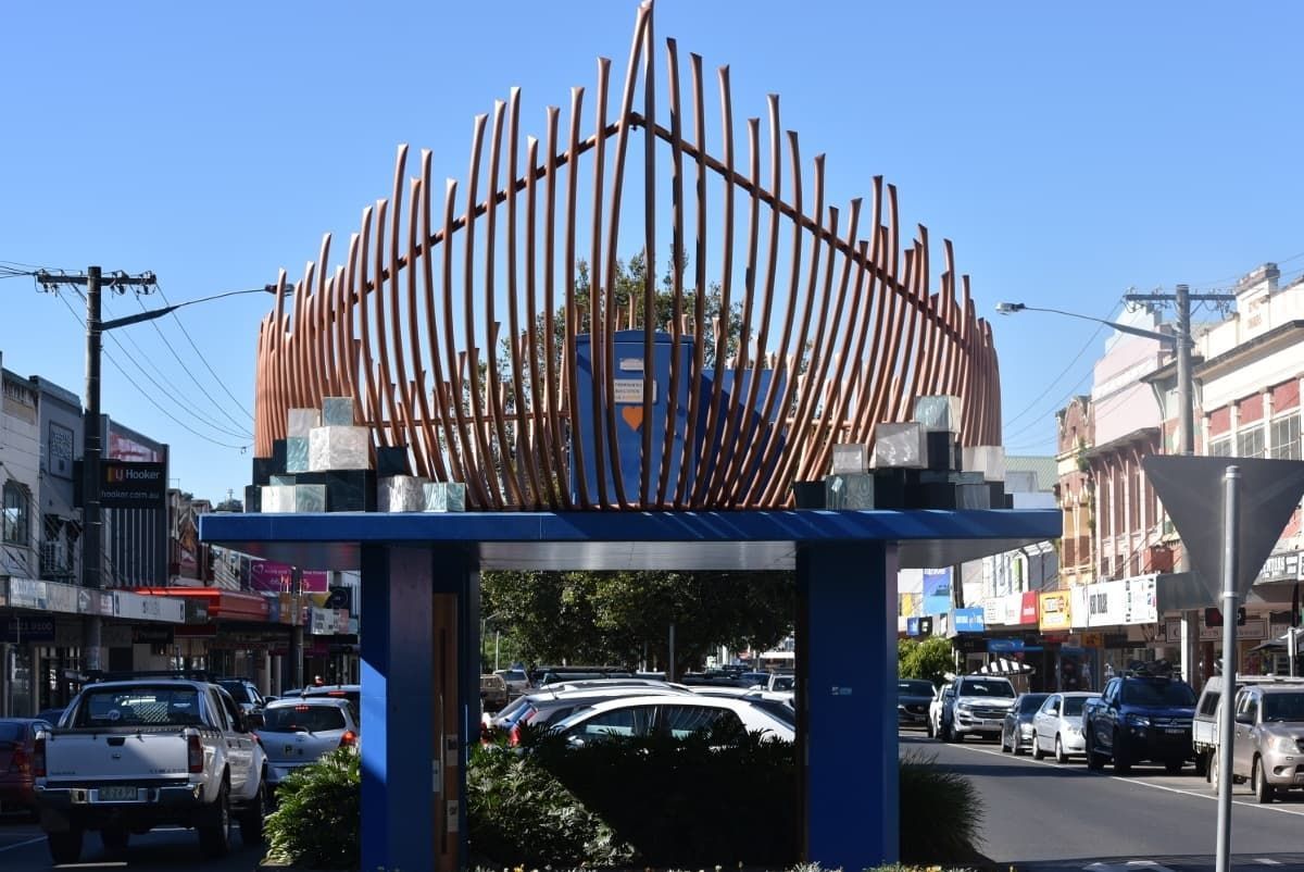A Large Sculpture Is in The Middle of A City Street — Rooftech Roofing Services in Lismore, NSW
