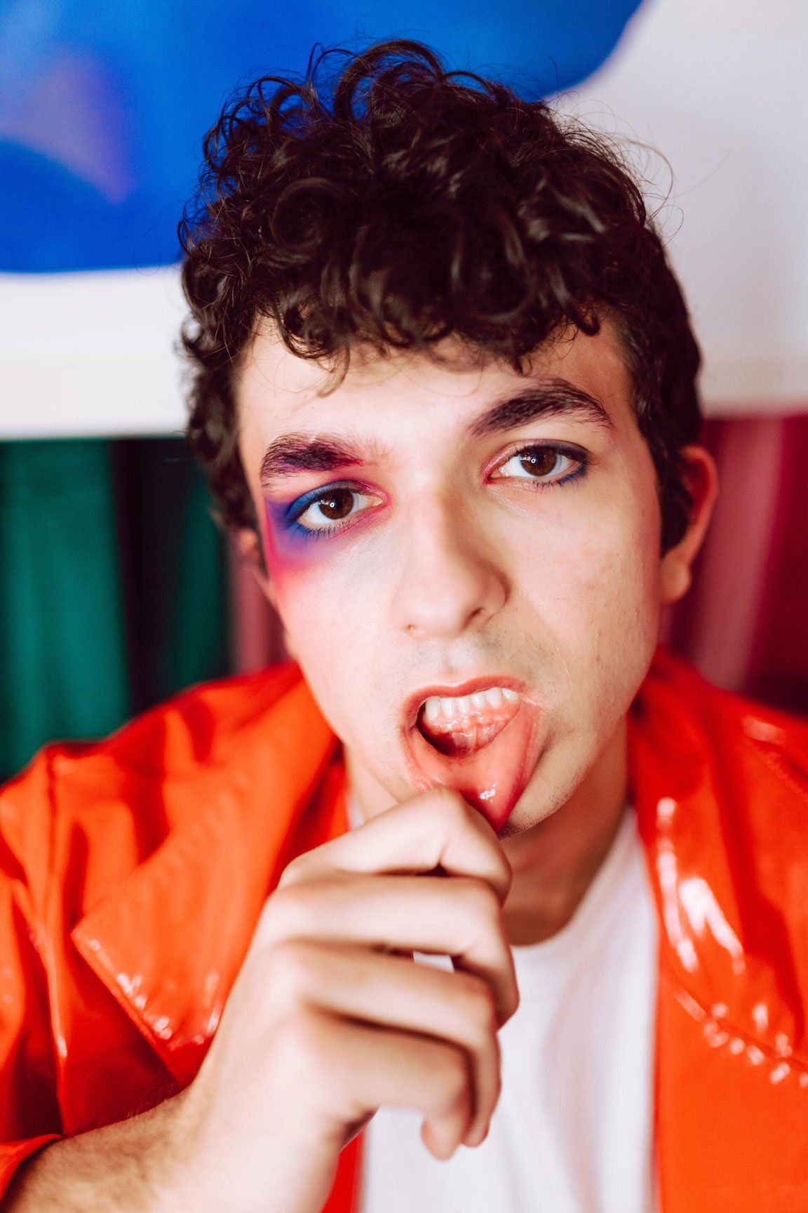Person in red jacket w/ makeup

