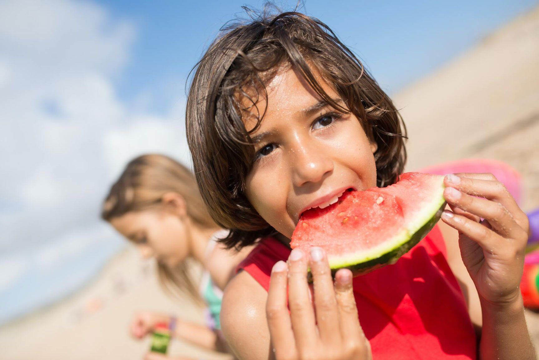 Kid eating watermelon
