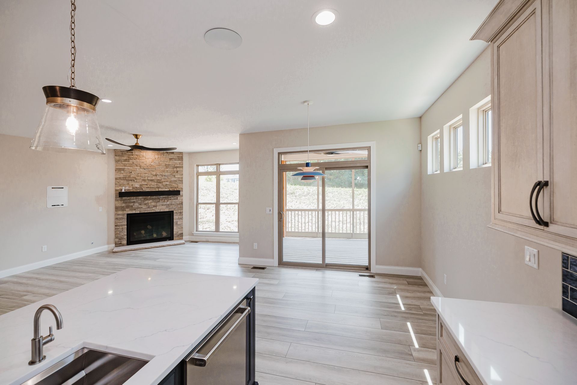 Open-concept living space of the Humphrey Bogart model with kitchen island.