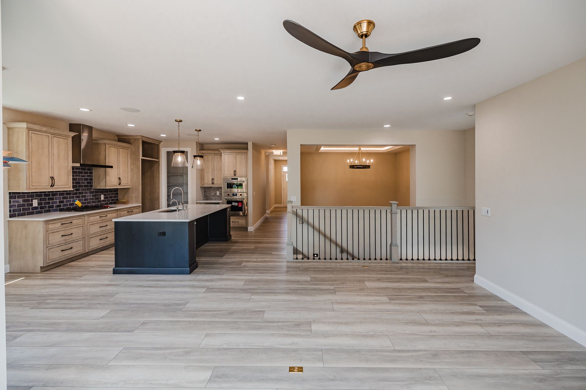 Spacious modern kitchen in the Humphrey Bogart model with light wood cabinets.