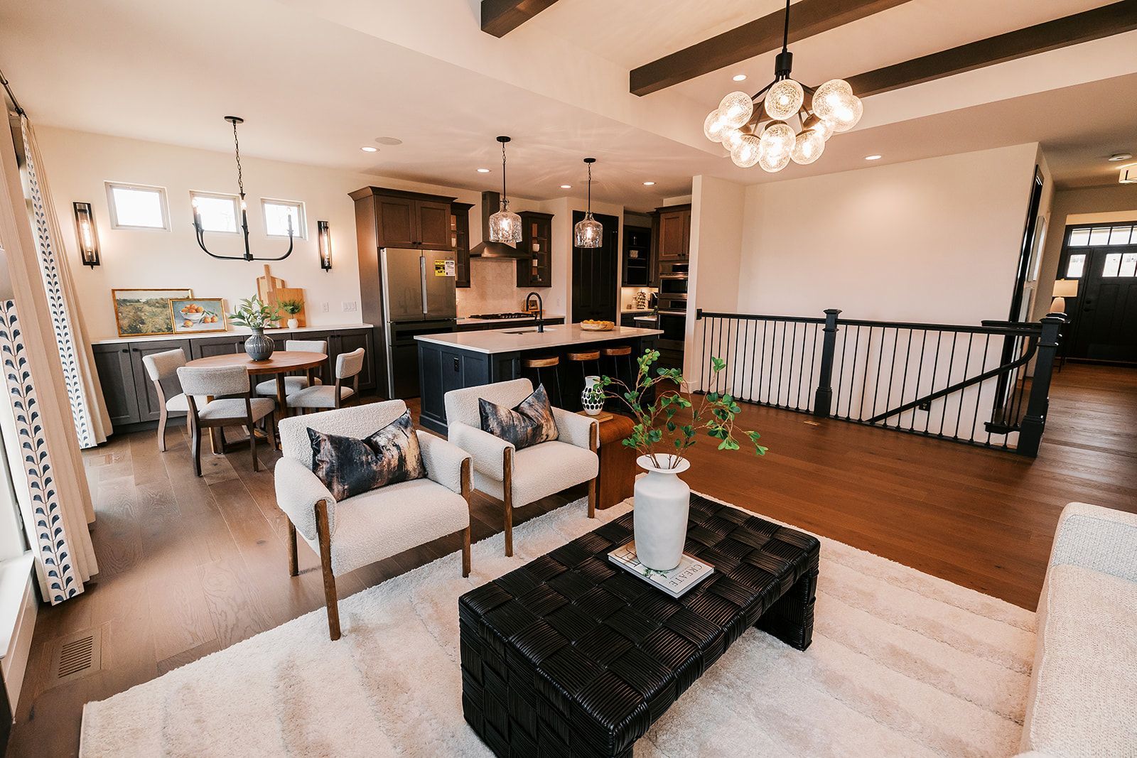 Open-concept living space at The Enclave at Tesson Ridge with kitchen, dining area, and living room.
