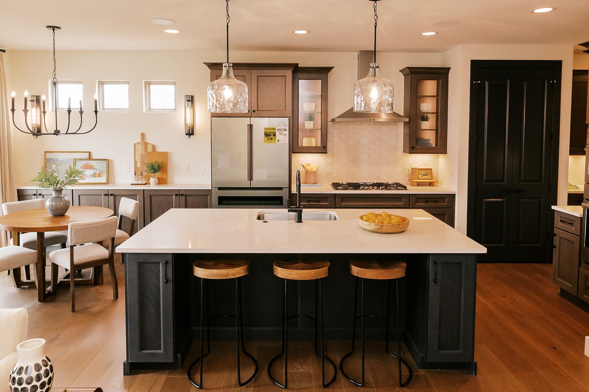 Modern kitchen in the Cary Grant model with island and seating.