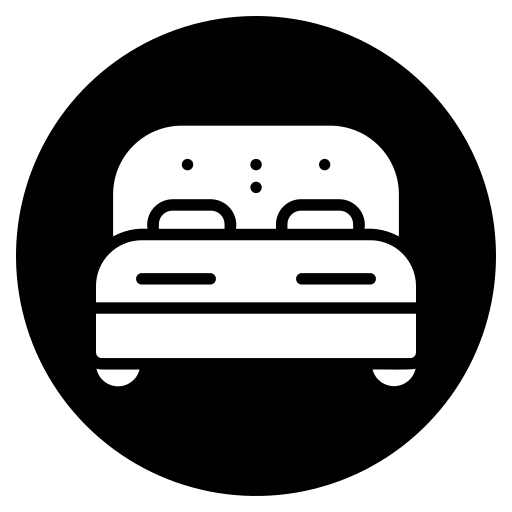 White bed icon in a black circle.