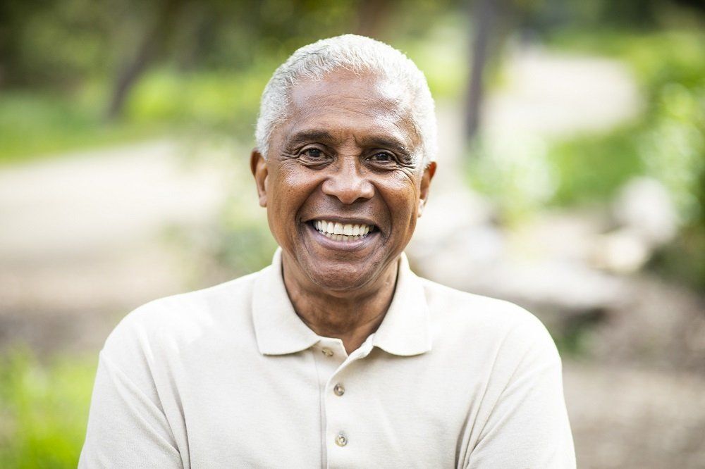Elderly Woman Enjoying Her Smile — Hammond, LA — Dental Care Associates A patient satisfied with new dentures near Osyka, MS