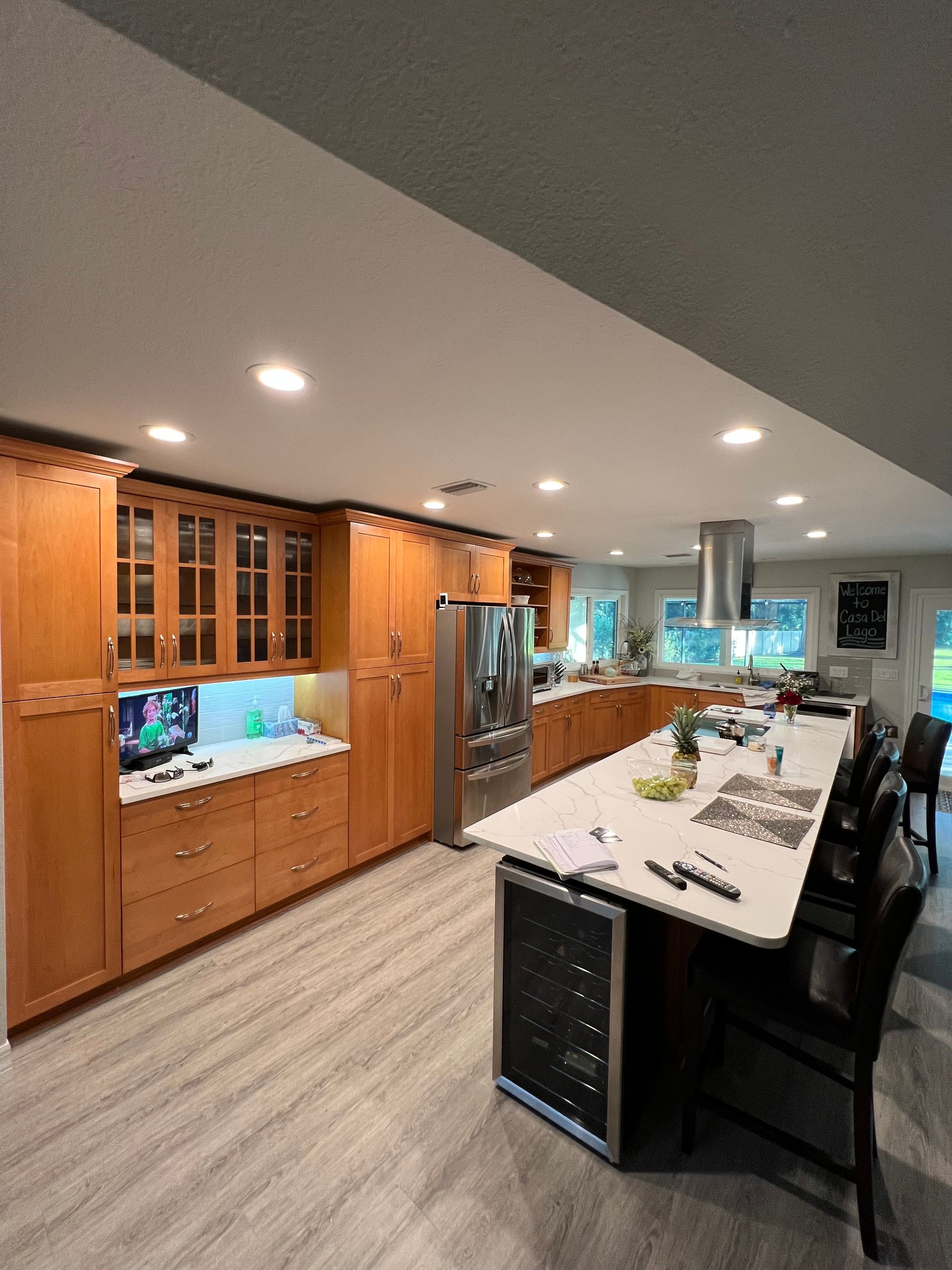 a kitchen with stainless steel appliances and wooden cabinets
