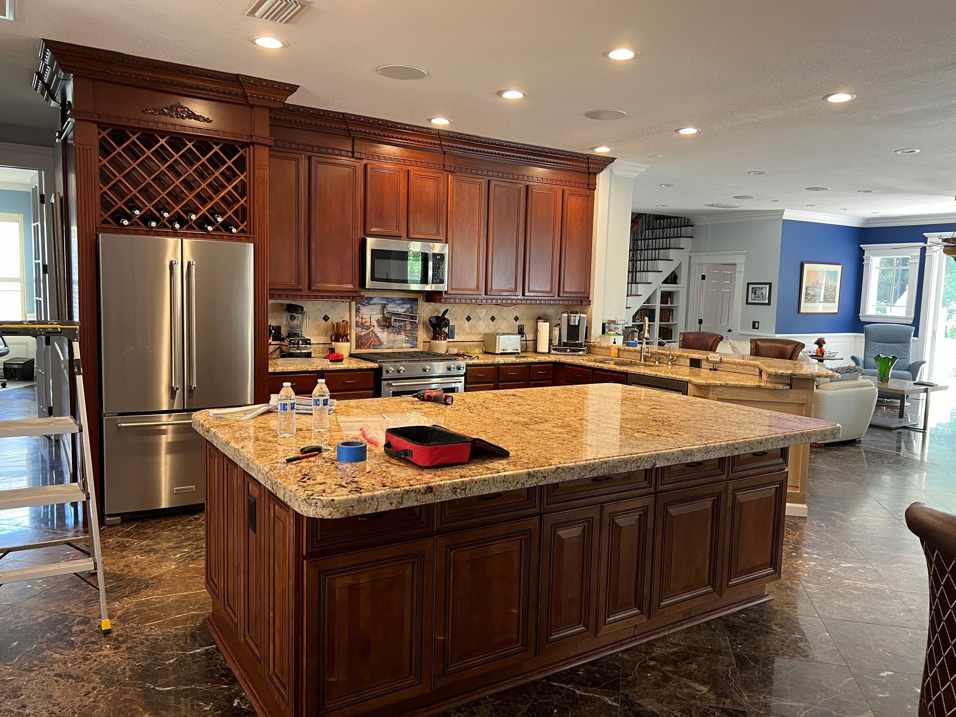 a kitchen with stainless steel appliances and granite counter tops