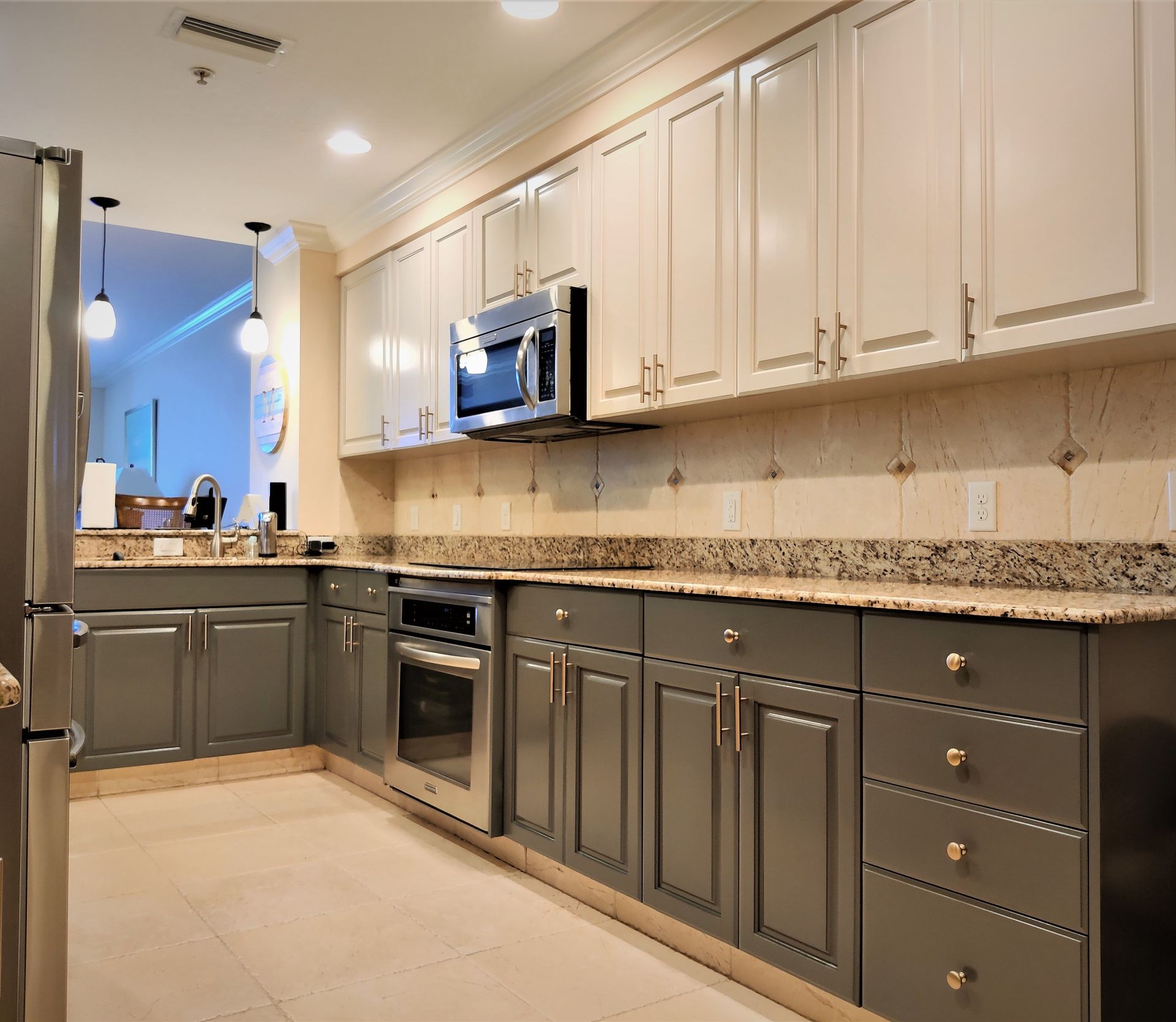 a kitchen with stainless steel appliances and granite counter tops