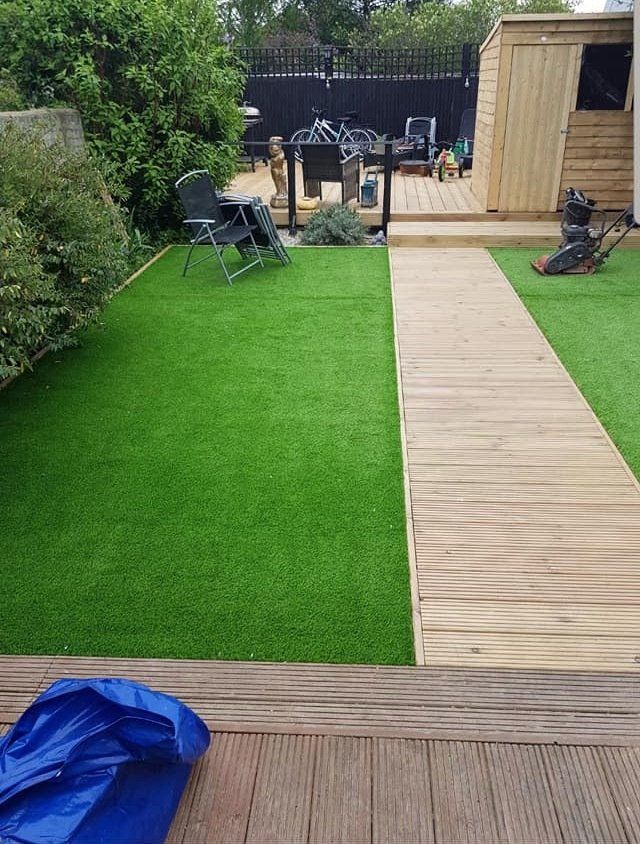 Artificial grass and decking by Walton Paving