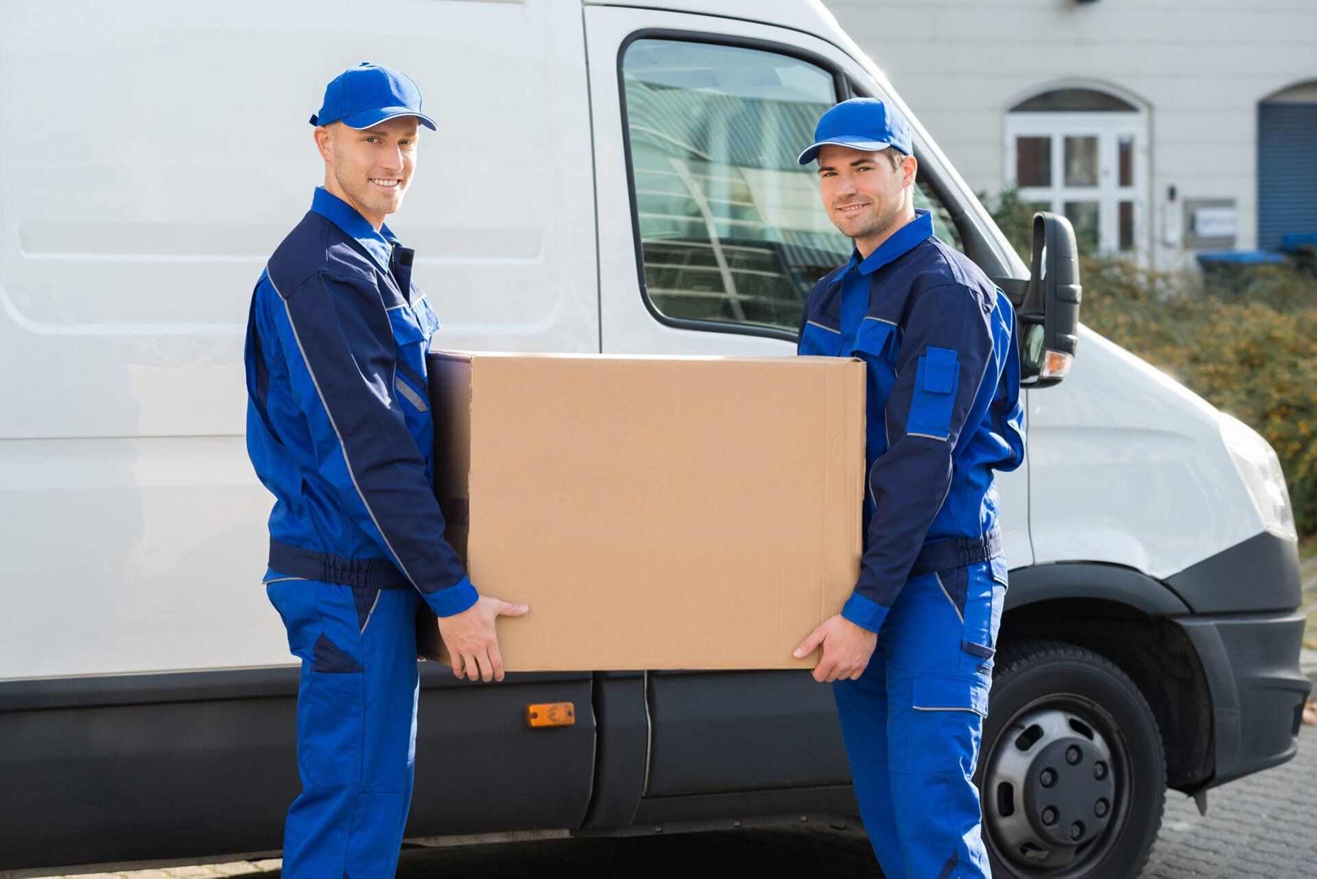 Two men carrying a large box — Prescott Valley, AZ — Help-U-Move
