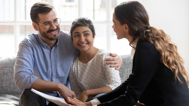 Woman sitting while holding a book — Fort Myers, FL — Jorge Santana Law