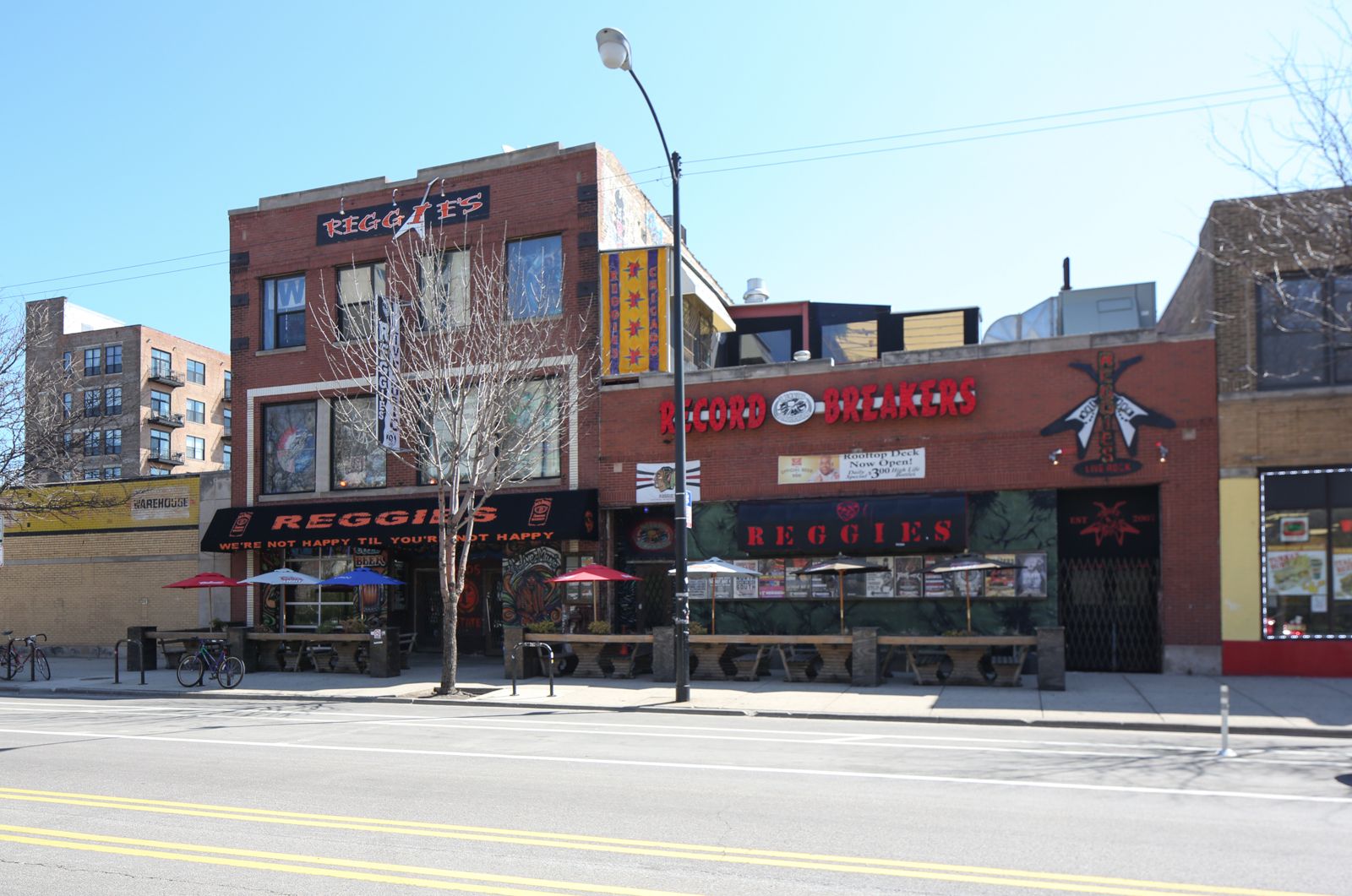 A brick building with a red sign that says ' red juice ' on it