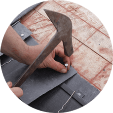 tile being nailed on the roof